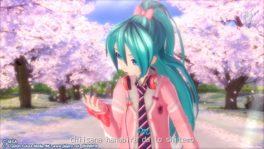 Hatsune Miku, wearing a pink school uniform sweater and catching a cherry blossom petal in her hand. Rows of cherry trees are blooming in the background. Text reads: chiisana hanabira da to shitemo